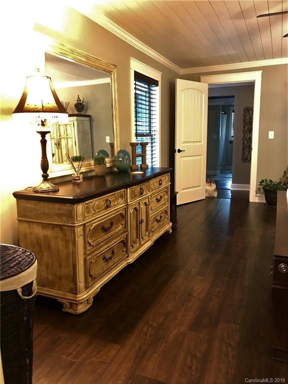 114 Riverview Road Tryon, NC 28782 - Photo 12 of 32 a room with table chairs and wooden floor