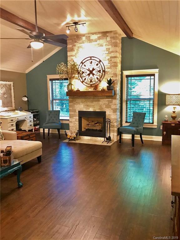114 Riverview Road Tryon, NC 28782 - Photo 3 of 32 a living room with furniture and a fireplace