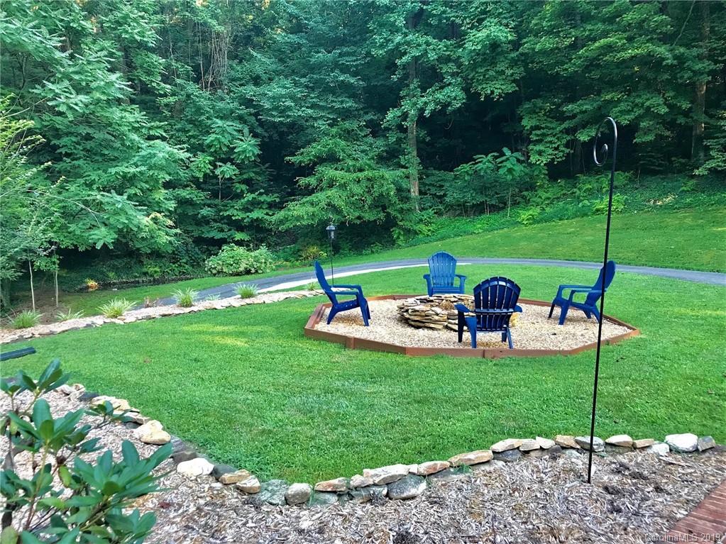 114 Riverview Road Tryon, NC 28782 - Photo 26 of 32 a view of a garden with an outdoor space