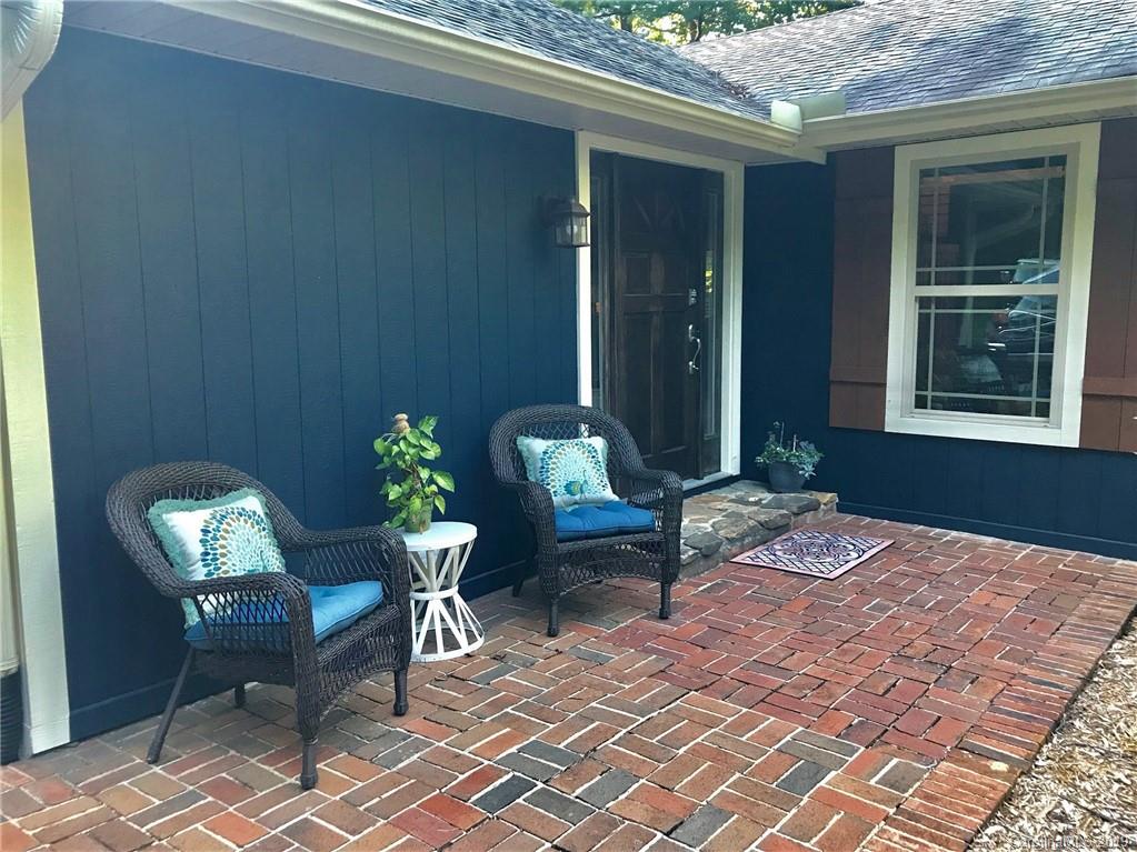 114 Riverview Road Tryon, NC 28782 - Photo 27 of 32 a outdoor space with furniture and potted plants