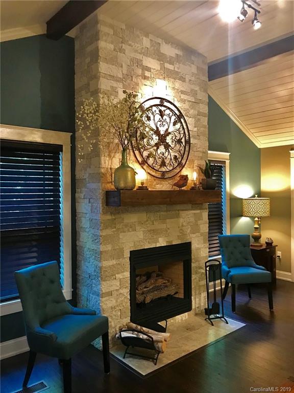 114 Riverview Road Tryon, NC 28782 - Photo 4 of 32 a living room with furniture and a fireplace