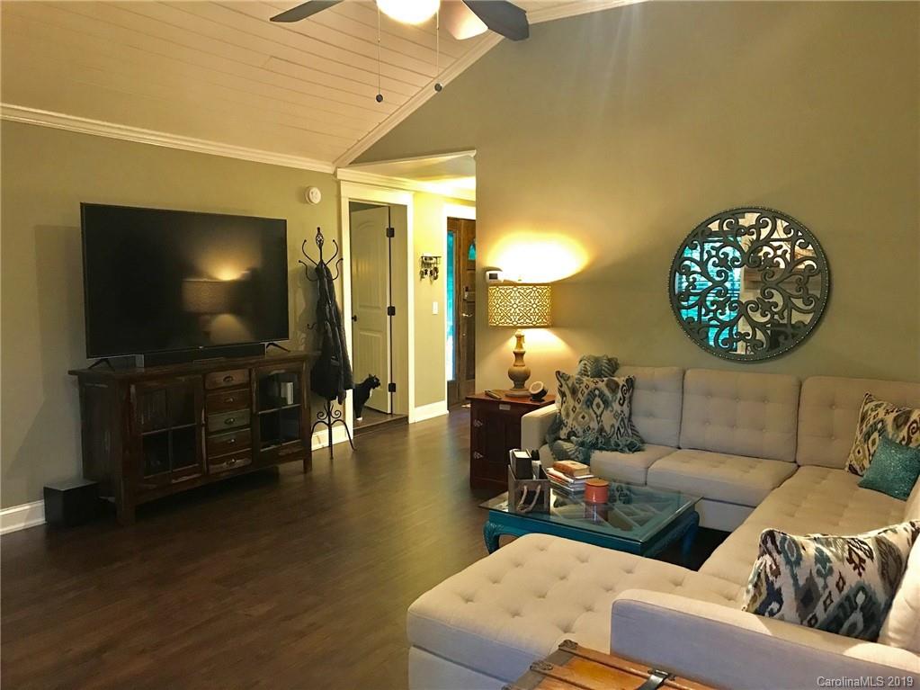 114 Riverview Road Tryon, NC 28782 - Photo 5 of 32 a living room with furniture and a flat screen tv