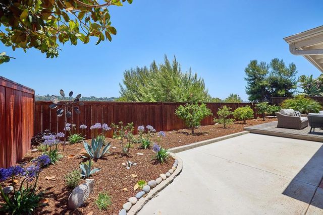 a garden view with a seating space