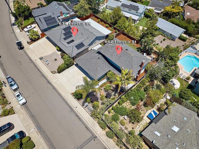 an aerial view of a residential building with an outdoor space