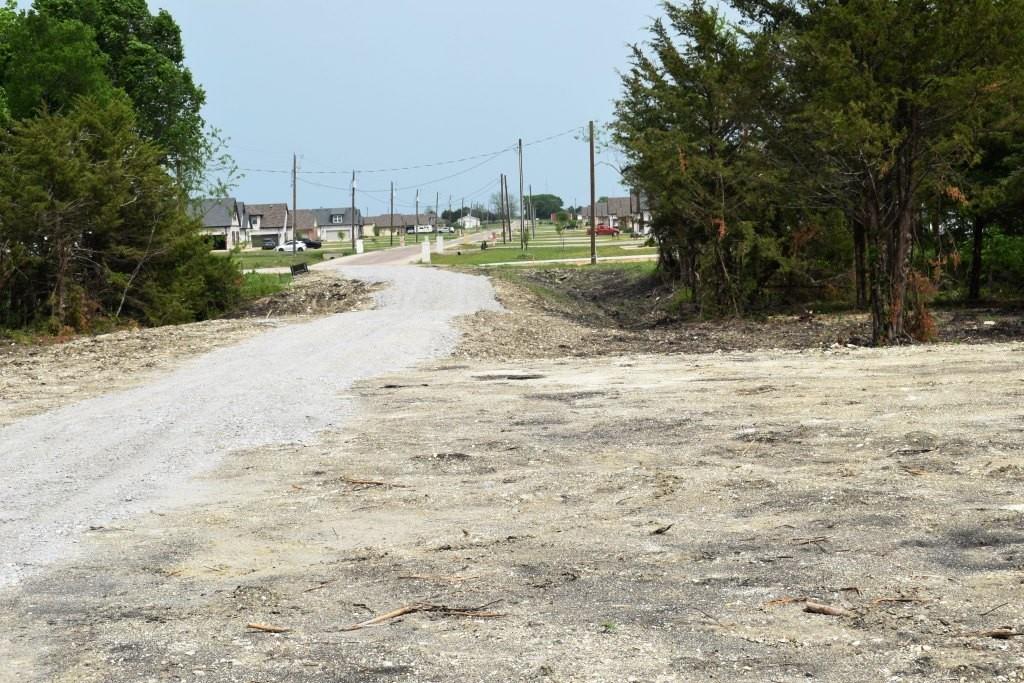 730 Cheyenne Trail Trenton, TX 75490 - Photo 17 of 19 a view of ocean view with large trees