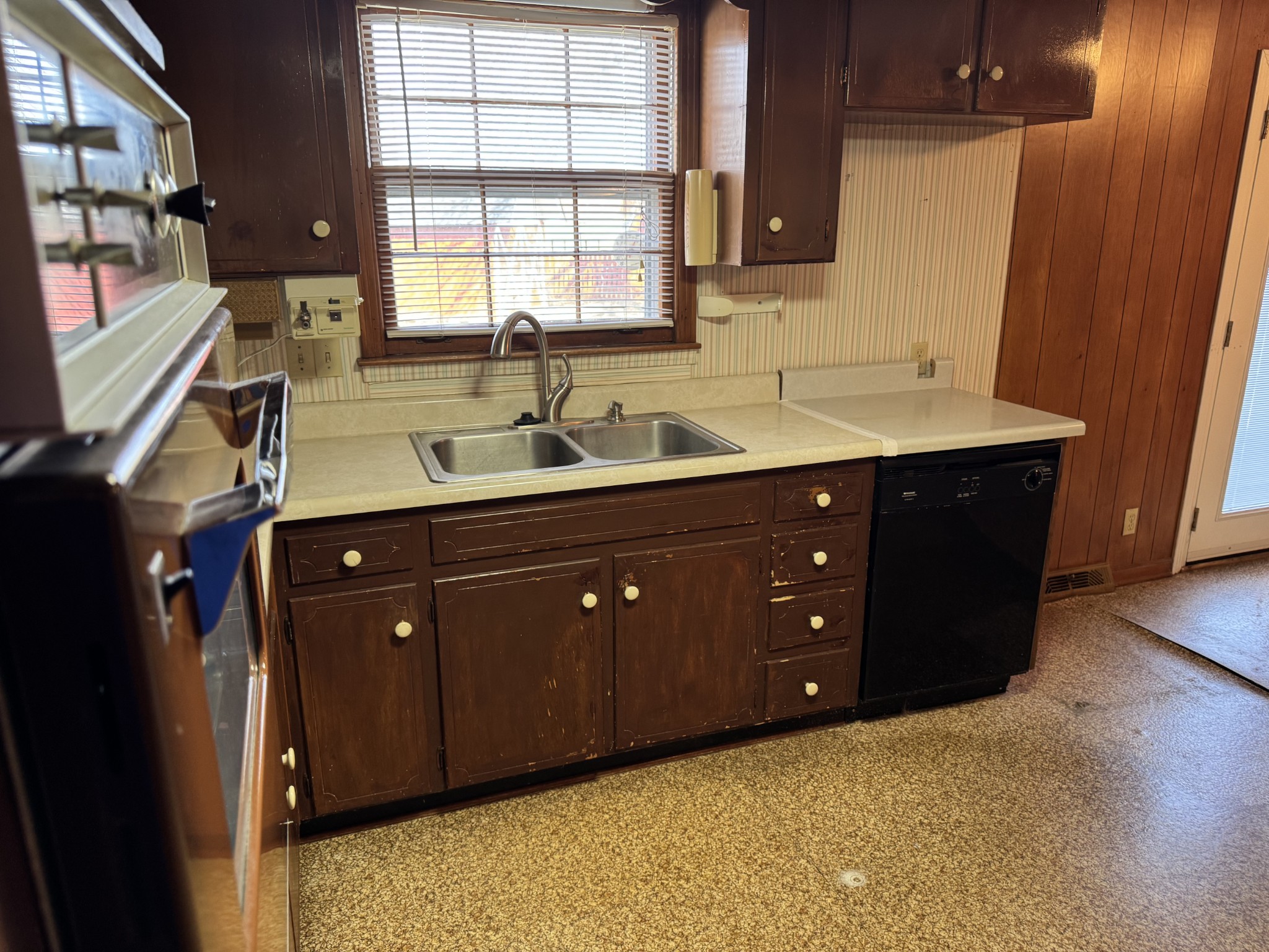 201 Orchard Road Clarksville, TN 37042 - Photo 5 of 24 a kitchen with a sink and wooden cabinets