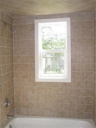 26 Hopewell Road Boston, MA 02136 - Photo 11 of 16 a bathroom with a window a bathtub and shower