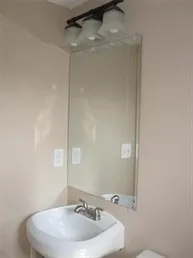 a bathroom with a sink and mirror