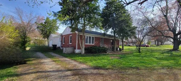 a utility room with cabinets washer and dryer