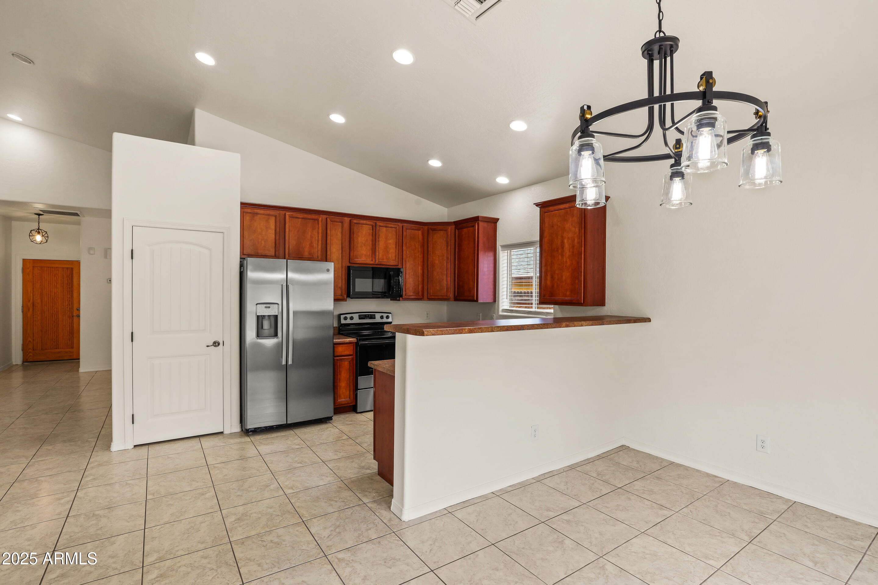 1014 West Summit Street Payson, AZ 85541 - Photo 14 of 21 a kitchen with stainless steel appliances granite countertop a refrigerator and a sink
