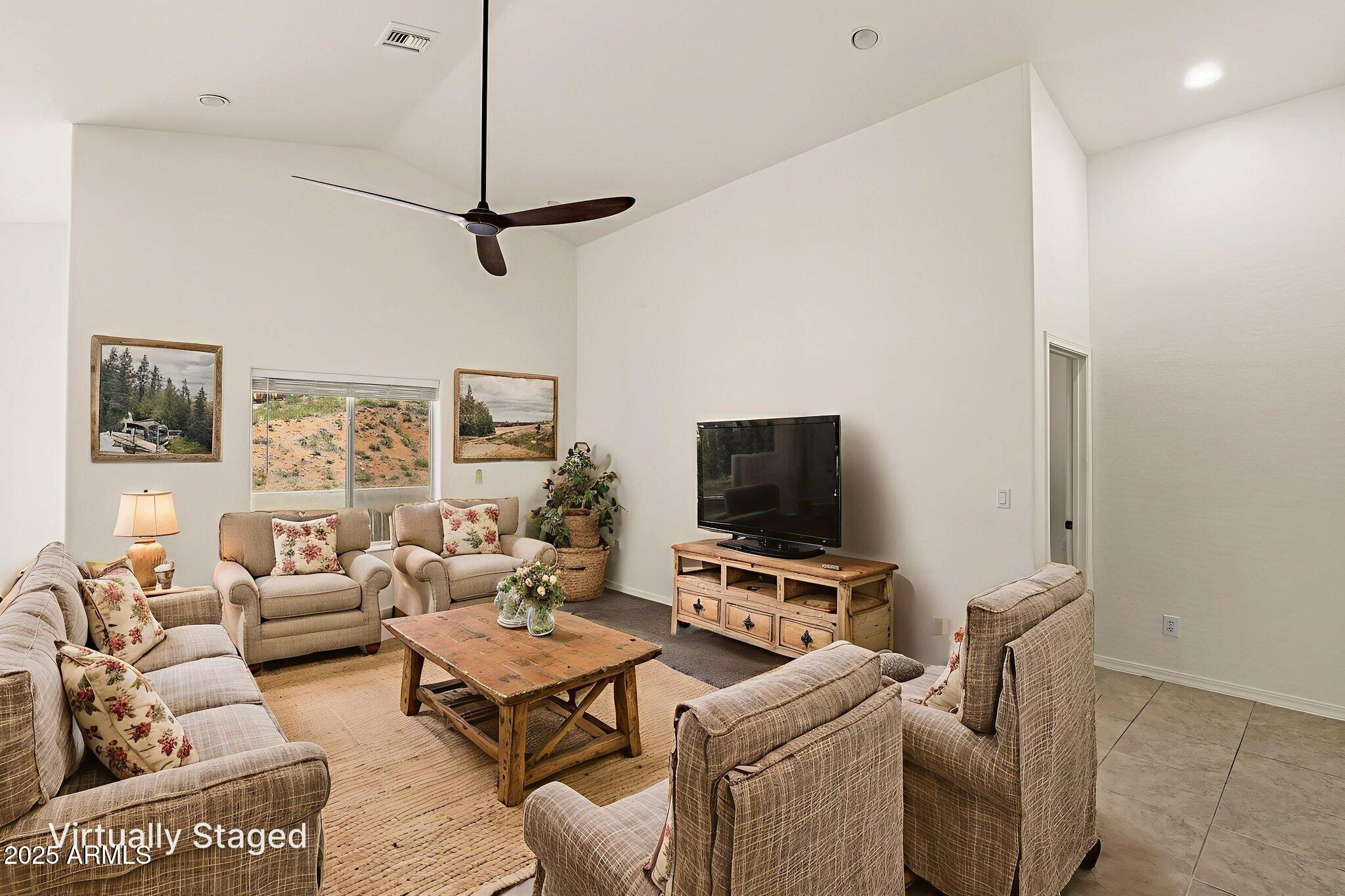 1014 West Summit Street Payson, AZ 85541 - Photo 2 of 21 a living room with furniture and a flat screen tv