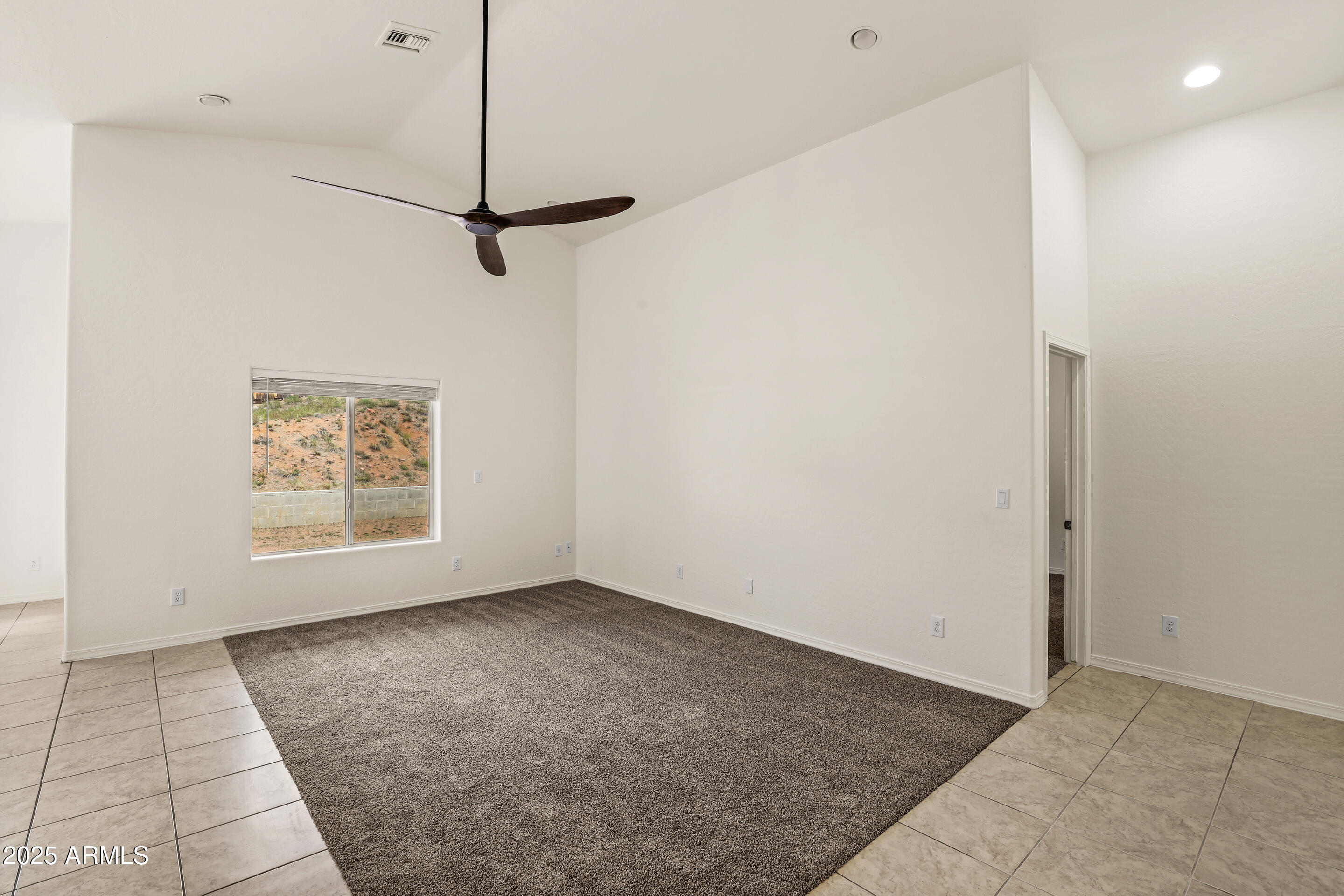 1014 West Summit Street Payson, AZ 85541 - Photo 3 of 21 a view of an empty room with a window