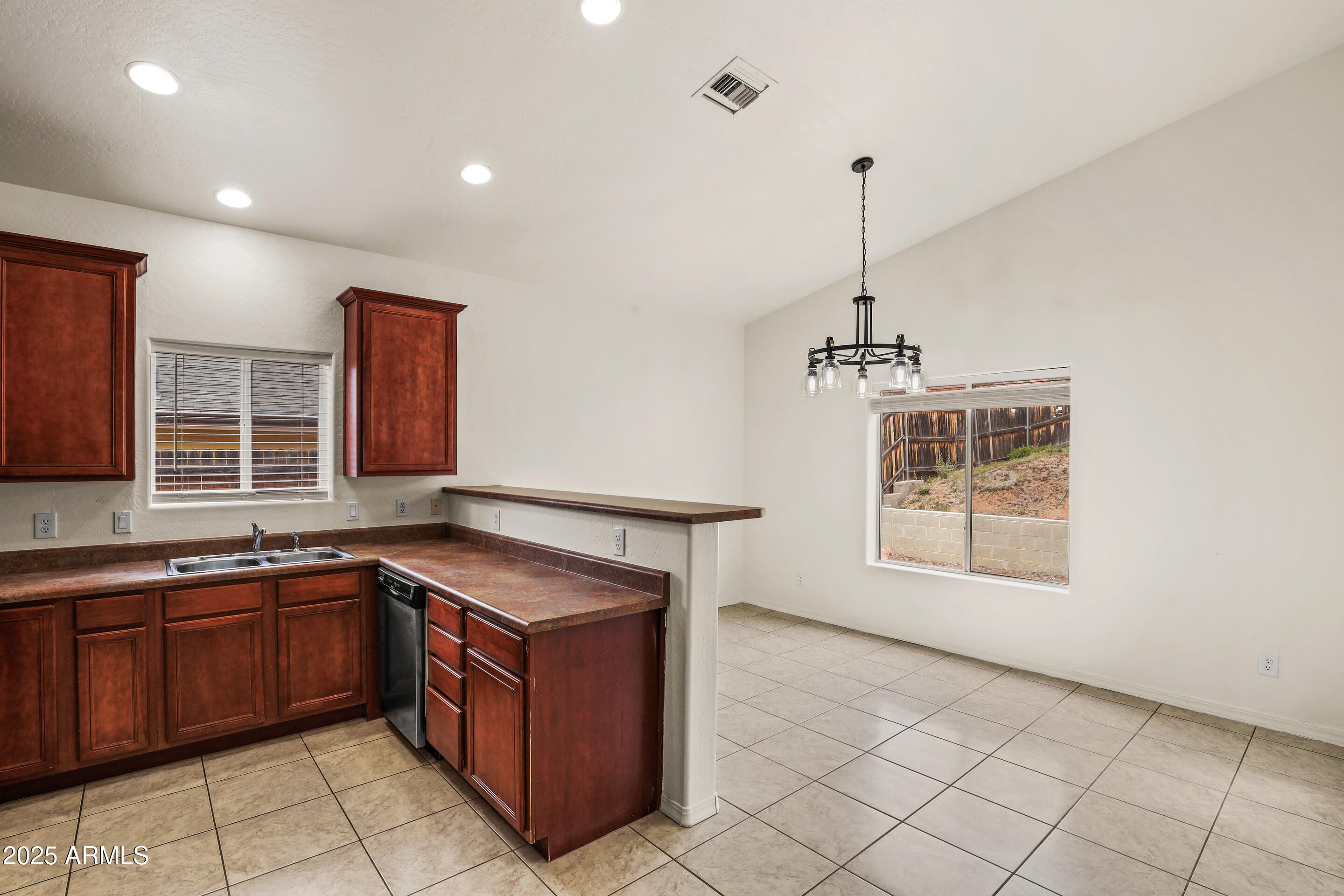 1014 West Summit Street Payson, AZ 85541 - Photo 5 of 21 a kitchen with a stove sink and cabinets