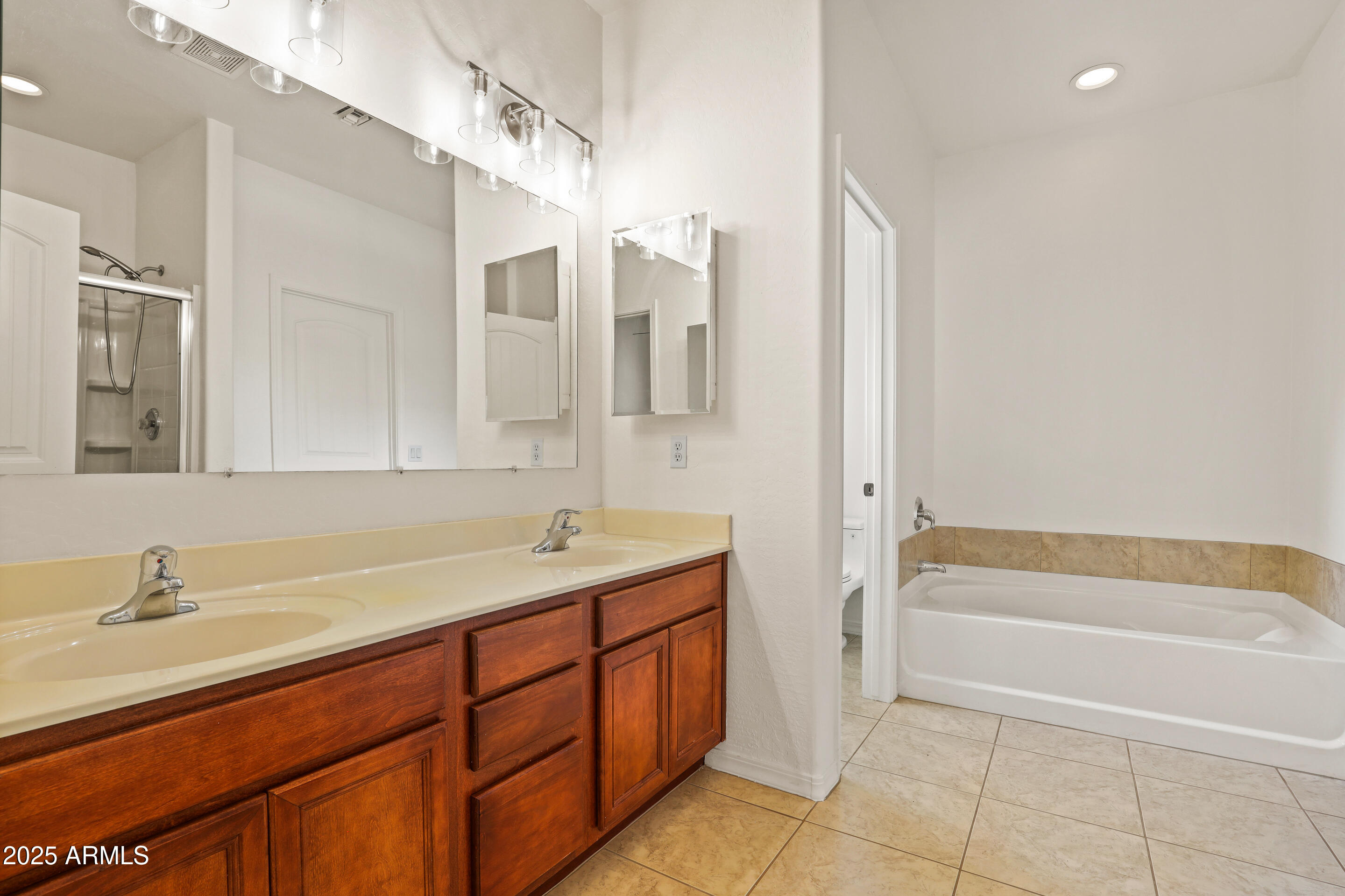 1014 West Summit Street Payson, AZ 85541 - Photo 9 of 21 a bathroom with a tub sink and mirror