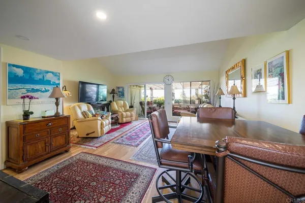 a living room with furniture fireplace and a table