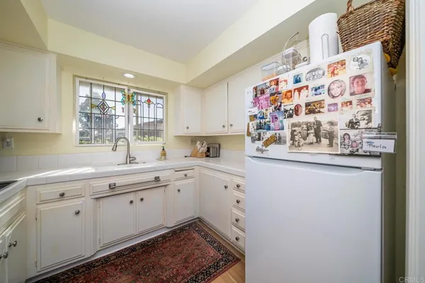 a kitchen with stainless steel appliances a sink and a window
