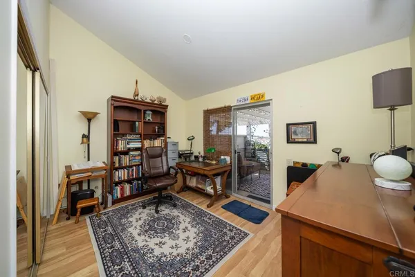 a living room with furniture and a rug