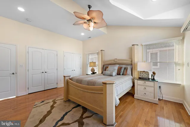 a bathroom with a tub a sink and mirror