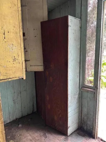 a view of a terrace with a chair and floor to ceiling window