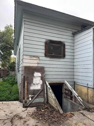 a view of a backyard with wooden fence