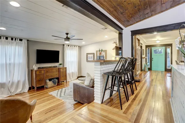 a view of a livingroom with furniture and a flat screen tv