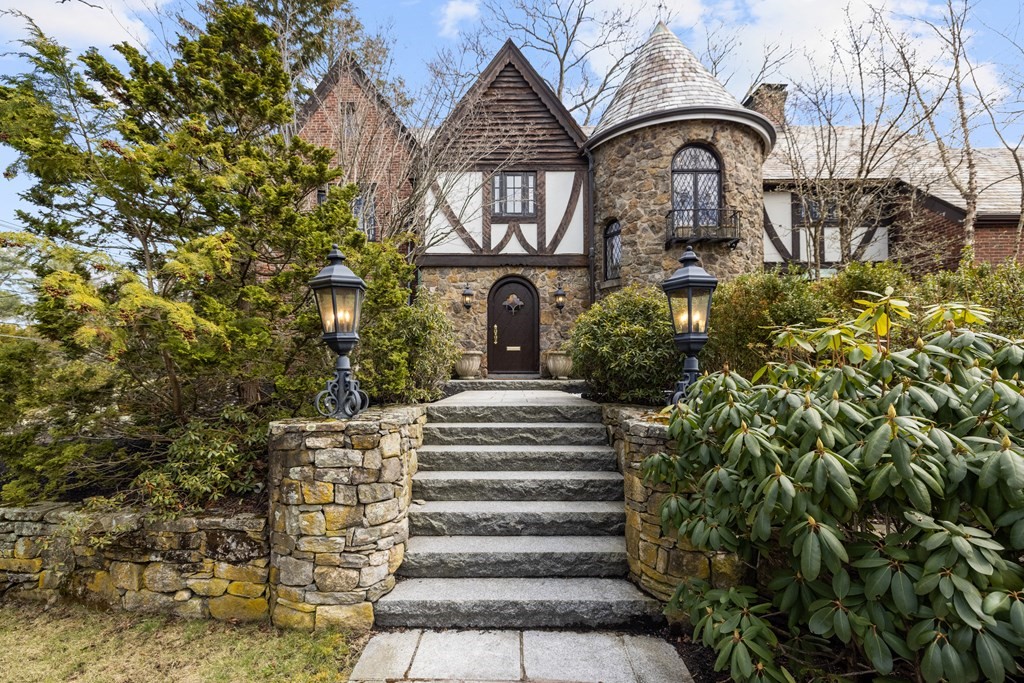 77 Hallwood Road Brookline, MA 02467 - Photo 1 of 42 a front view of a house with a garden