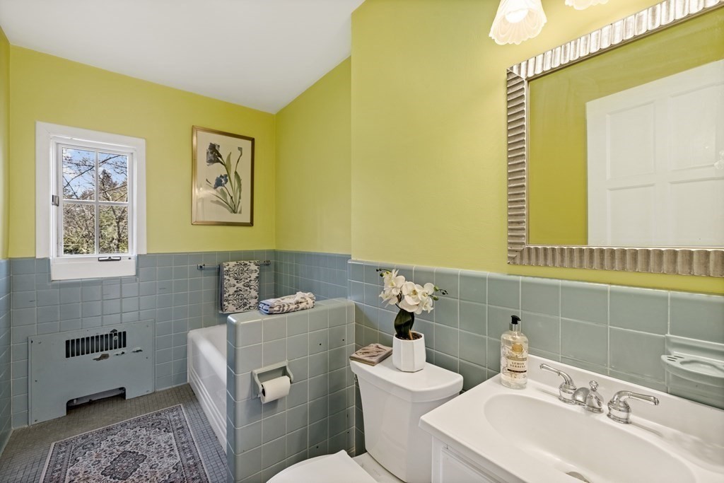 77 Hallwood Road Brookline, MA 02467 - Photo 18 of 42 a bathroom with a sink and a toilet