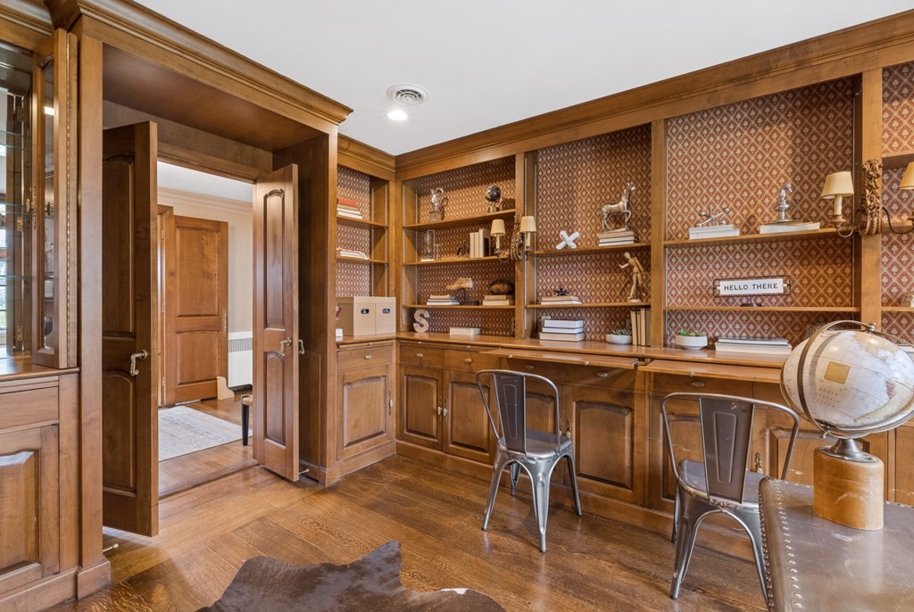 77 Hallwood Road Brookline, MA 02467 - Photo 20 of 42 a kitchen with a table chairs and a refrigerator