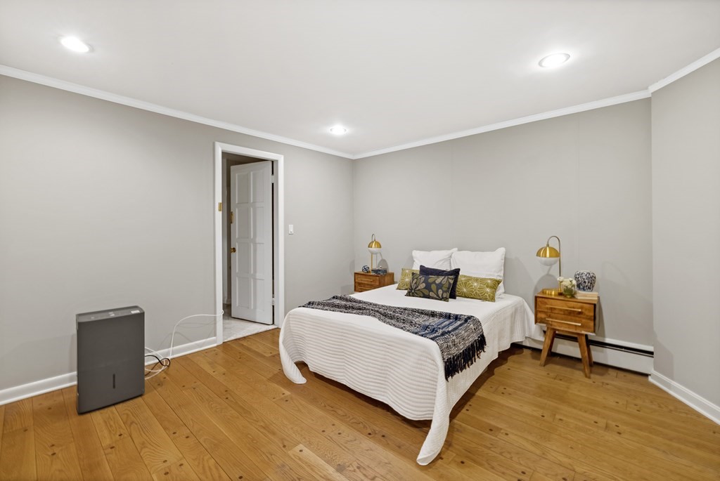 77 Hallwood Road Brookline, MA 02467 - Photo 38 of 42 a bedroom with a bed and a desk