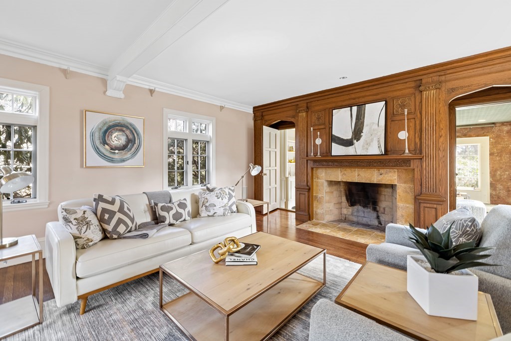 77 Hallwood Road Brookline, MA 02467 - Photo 4 of 42 a living room with furniture and a fireplace
