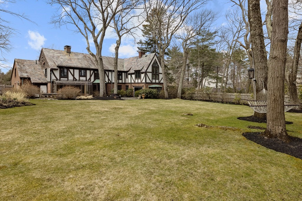 77 Hallwood Road Brookline, MA 02467 - Photo 41 of 42 a view of a house with a yard and tree s