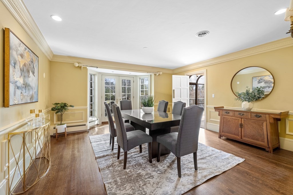 77 Hallwood Road Brookline, MA 02467 - Photo 9 of 42 a view of a dining room with furniture window and wooden floor
