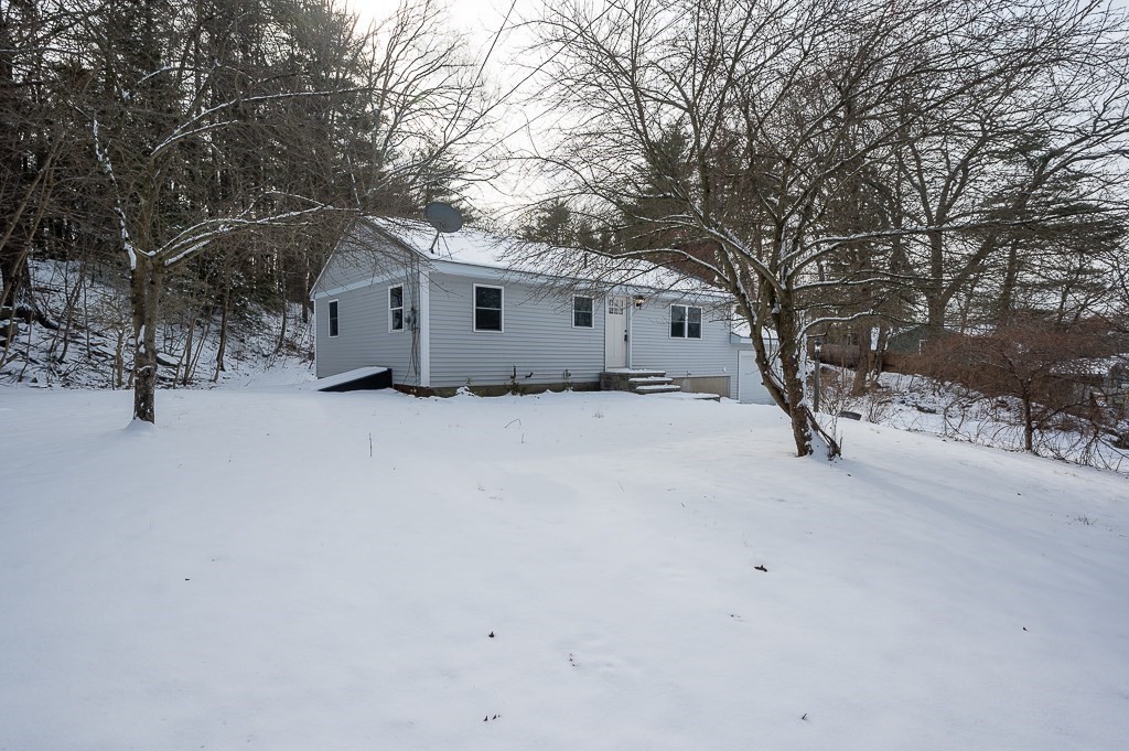 137 Fairview Park Road Sturbridge, MA 01566 - Photo 23 of 31 a white house that has a tree in front of it