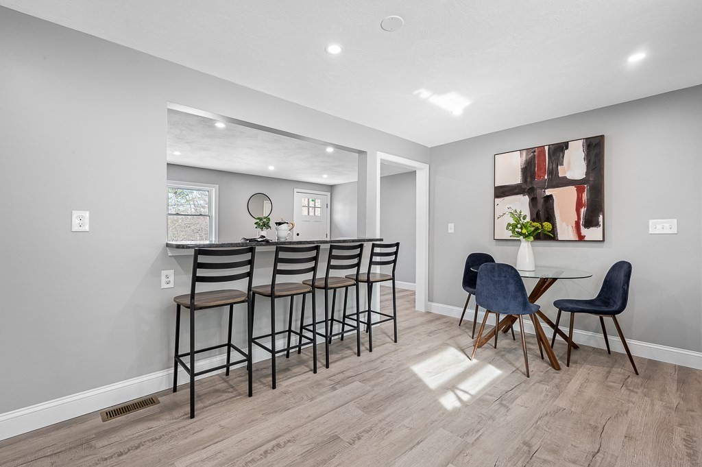 137 Fairview Park Road Sturbridge, MA 01566 - Photo 8 of 31 a view of a dining room with furniture and wooden floor