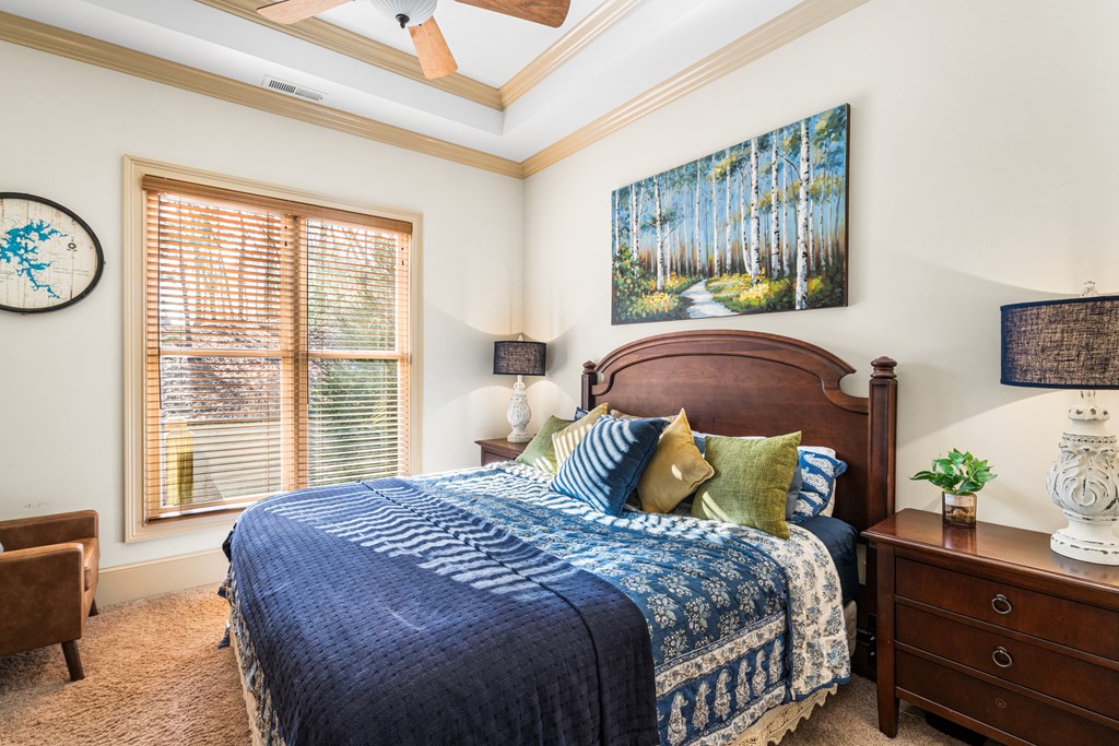 476 Licklog Ridge Hayesville, NC 28904 - Photo 27 of 41 a bedroom with a bed table and window