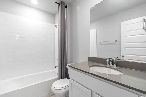 a view of an empty room and a window