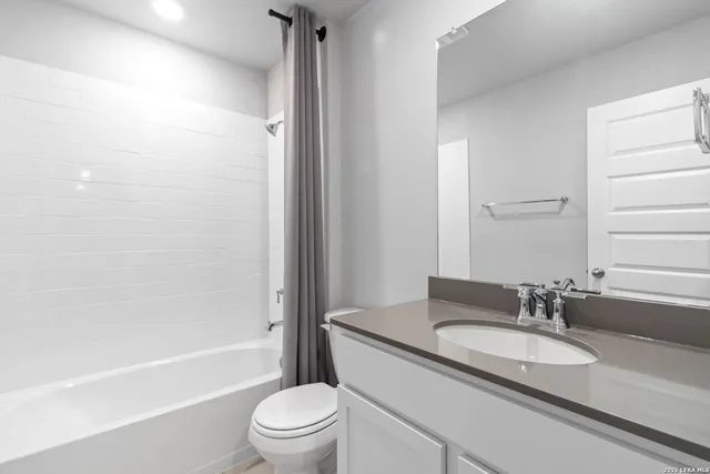 a view of an empty room and a window