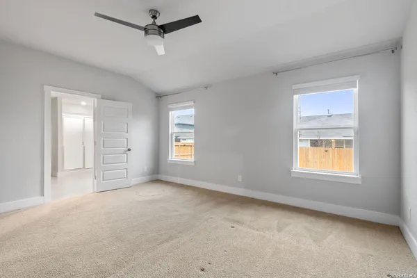 a bathroom with a double vanity sink and mirror