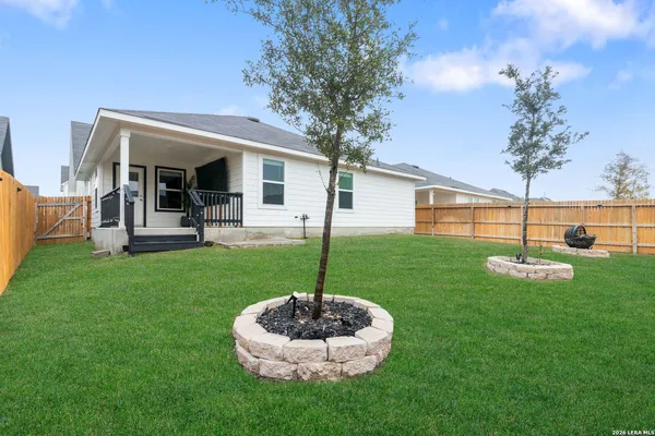 a view of a swimming pool with an outdoor seating