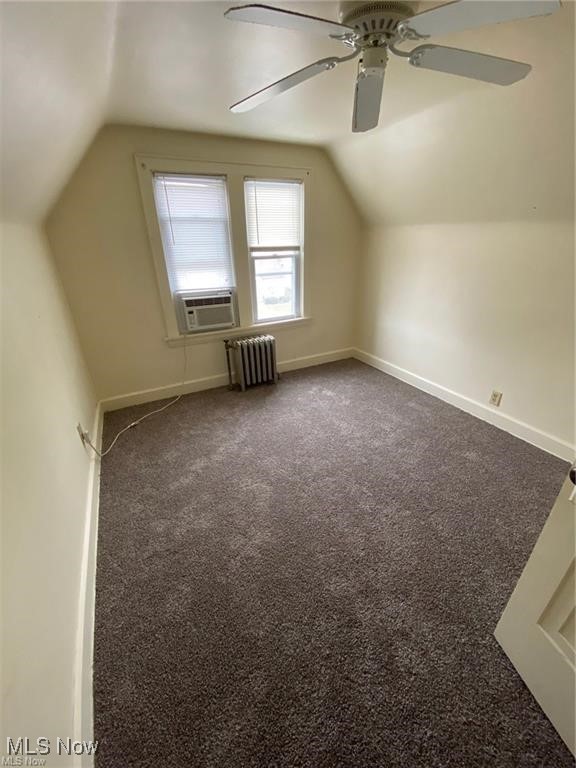 642 East Wilbeth Road Akron, OH 44306 - Photo 32 of 39 Unit 4 bedroom 2 featuring radiator, cooling unit, lofted ceiling, and carpet floors