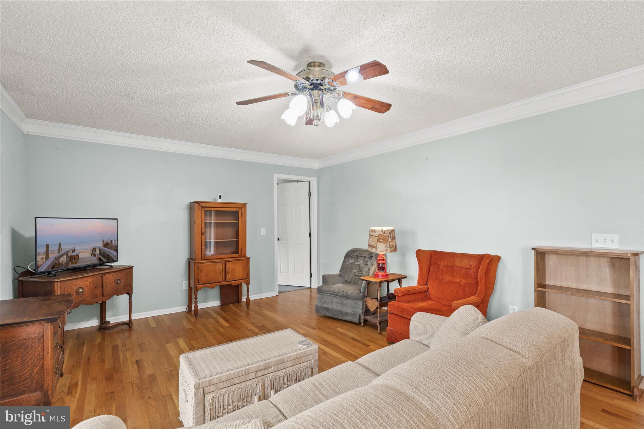 12647 Old Stage Road Bishopville, MD 21813 - Photo 68 of 84 a living room with furniture and a flat screen tv