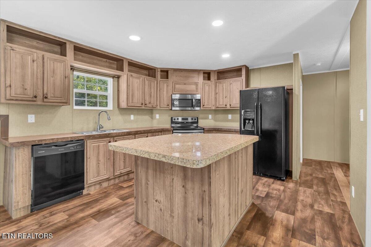 109 Post Oak Springs Road Rockwood, TN 37854 - Photo 13 of 24 a kitchen with stainless steel appliances granite countertop a sink stove and refrigerator
