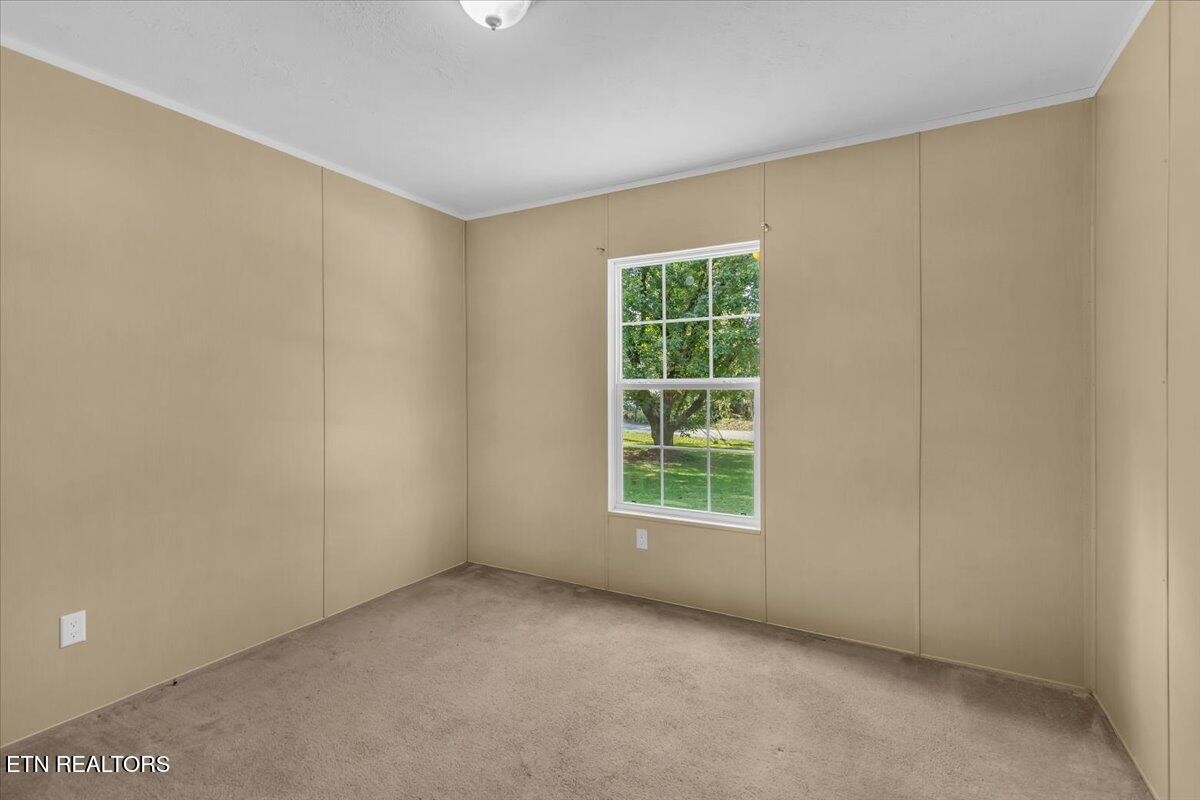 109 Post Oak Springs Road Rockwood, TN 37854 - Photo 16 of 24 an empty room with a window