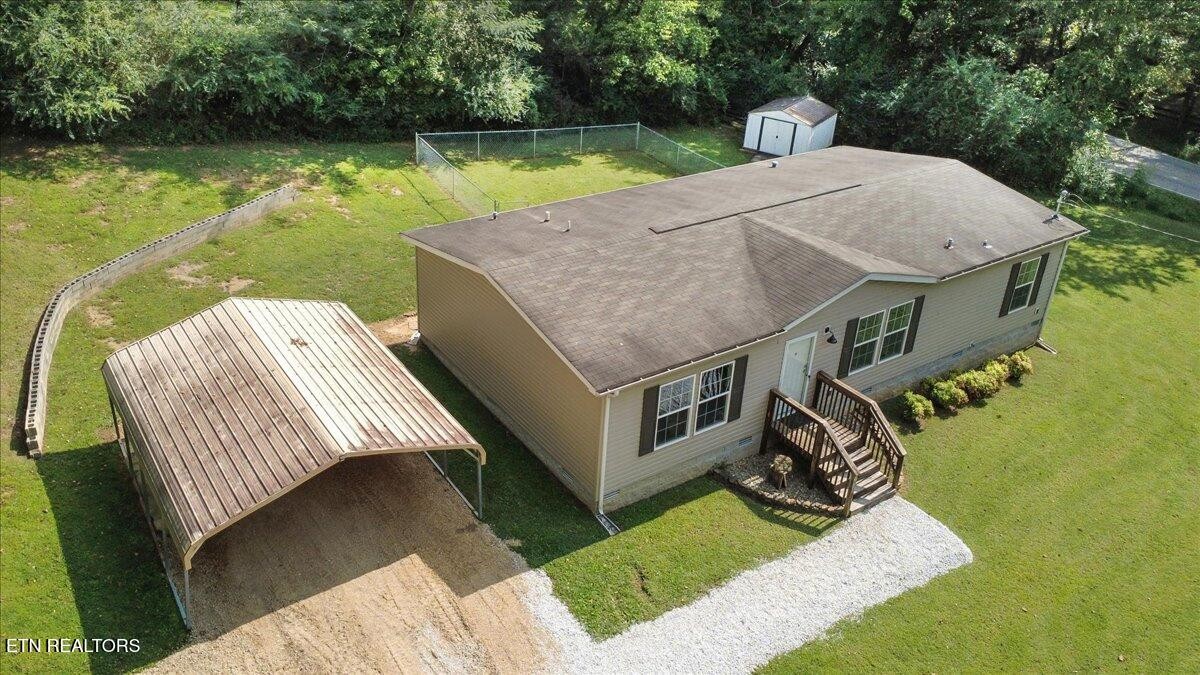 109 Post Oak Springs Road Rockwood, TN 37854 - Photo 2 of 24 a aerial view of a house with swimming pool table and chairs