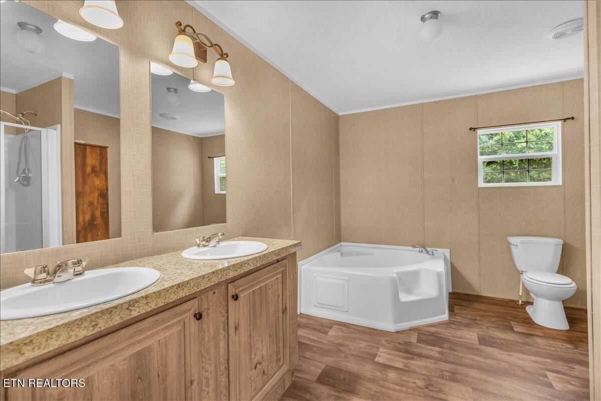 109 Post Oak Springs Road Rockwood, TN 37854 - Photo 21 of 24 a bathroom with a sink a toilet and a mirror