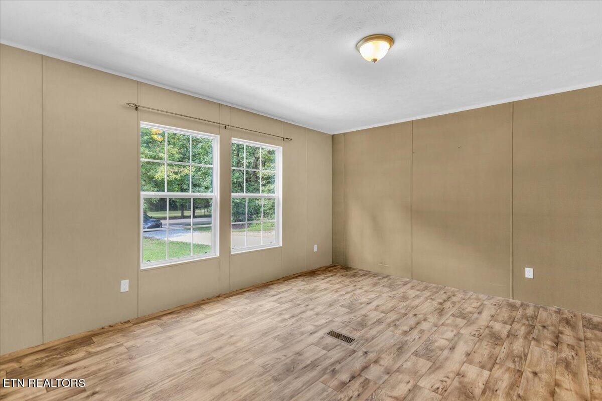 109 Post Oak Springs Road Rockwood, TN 37854 - Photo 22 of 24 a view of an empty room with a window