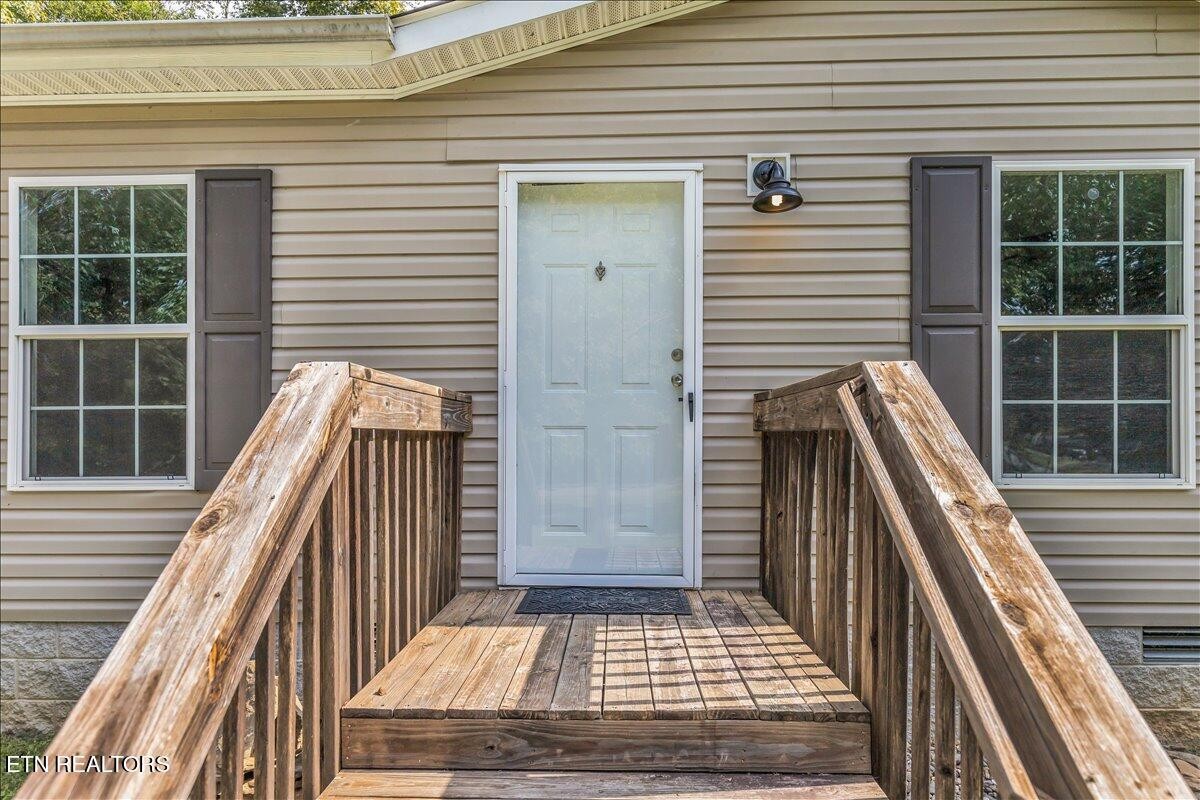109 Post Oak Springs Road Rockwood, TN 37854 - Photo 4 of 24 a view of balcony and wooden floor