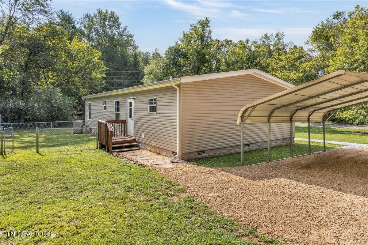 109 Post Oak Springs Road Rockwood, TN 37854 - Photo 8 of 24 a view of a house with backyard and trees