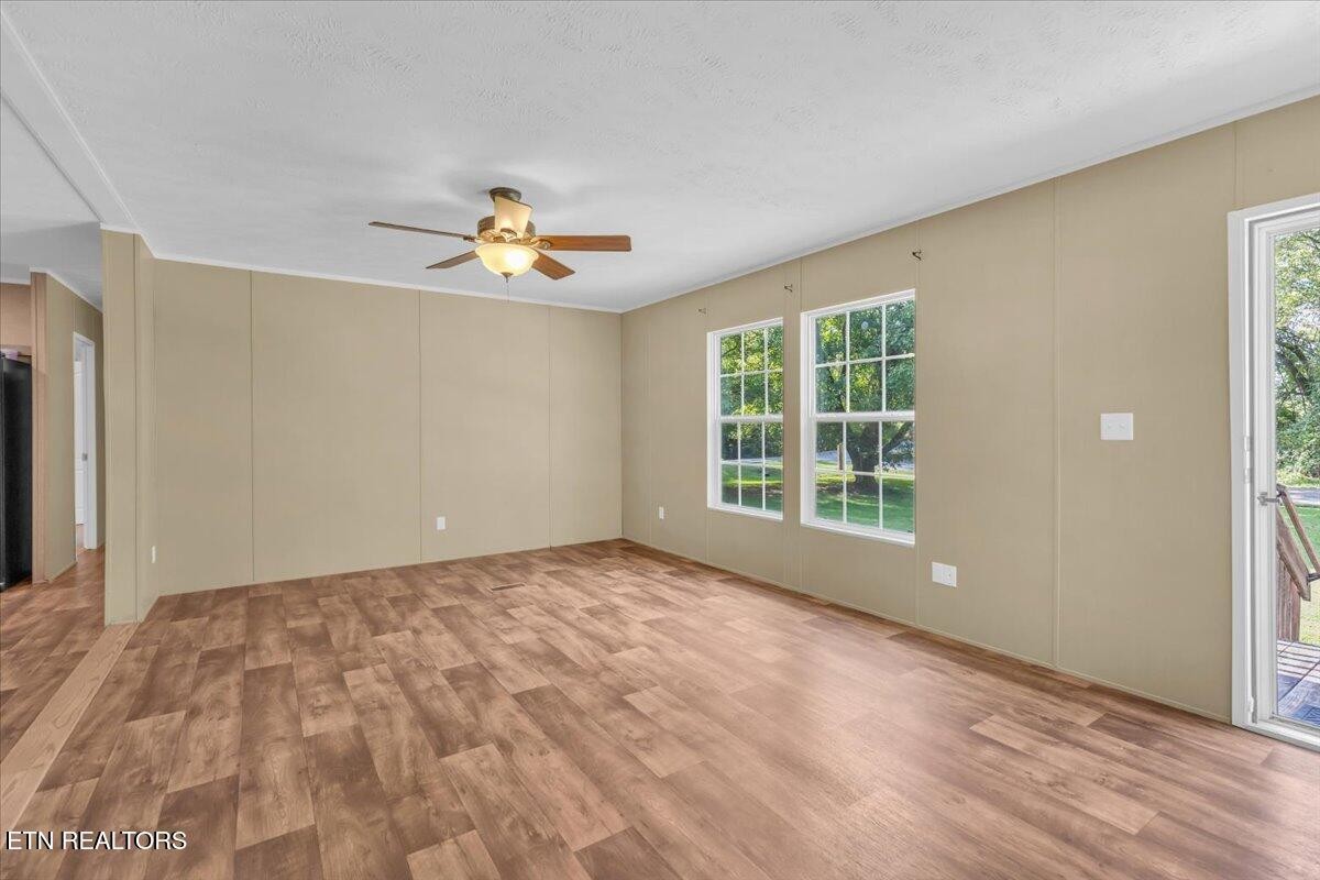 109 Post Oak Springs Road Rockwood, TN 37854 - Photo 9 of 24 a view of a room with a window and a ceiling fan