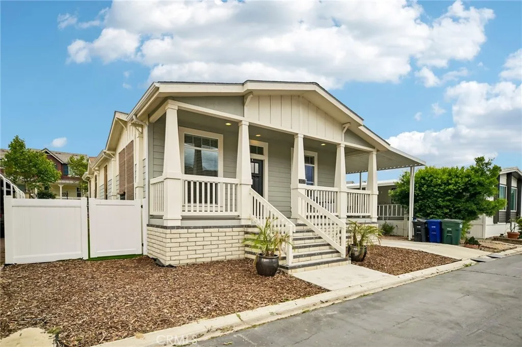 250 East Telegraph Road, Unit 307 Fillmore, CA 93015 - Photo 2 of 36 a view of a house with a small yard and plants